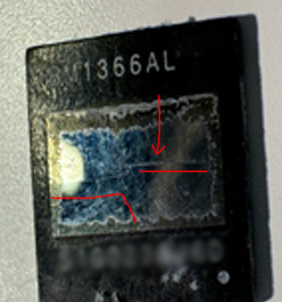 Damaged SHA-256 ASIC die close-up on an Antminer S21 Pro / S21 XP hashboard